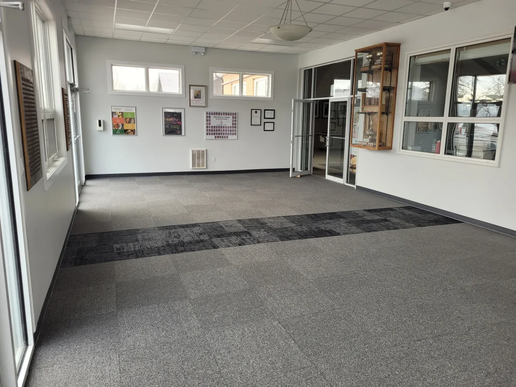 Newly installed commercial corridor flooring in a high traffic building