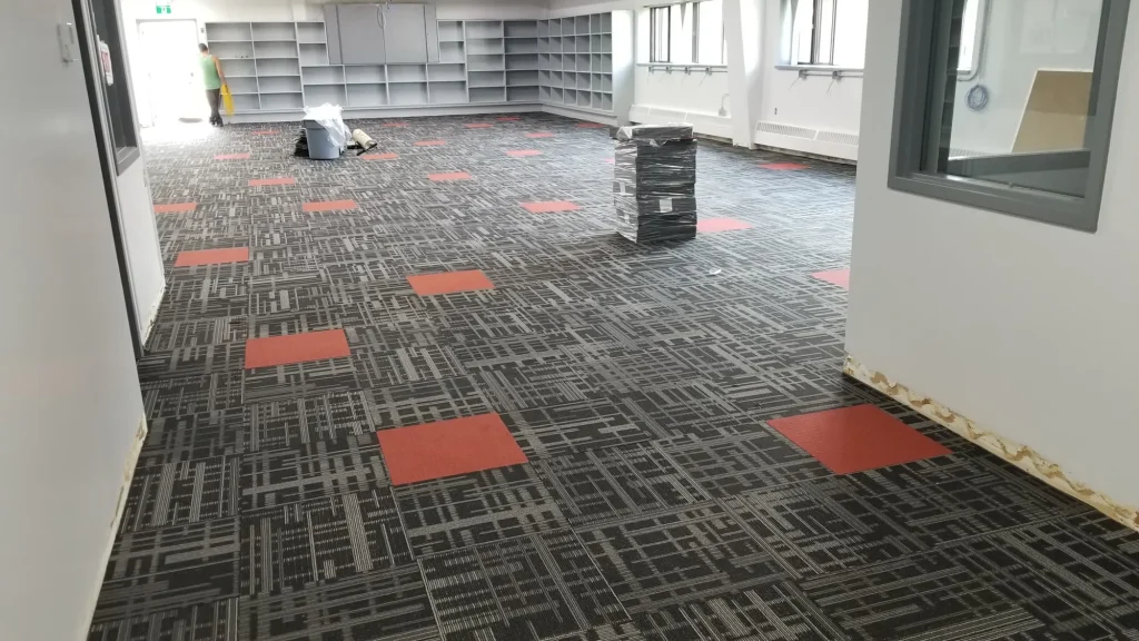 Newly installed commercial corridor flooring in a high traffic building