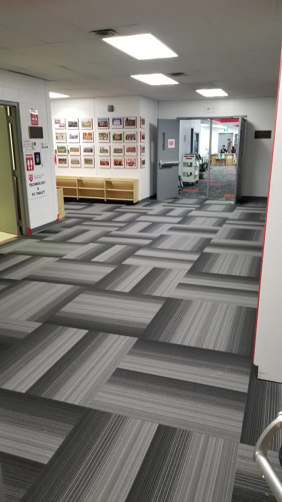 Newly installed commercial corridor flooring in a high traffic building
