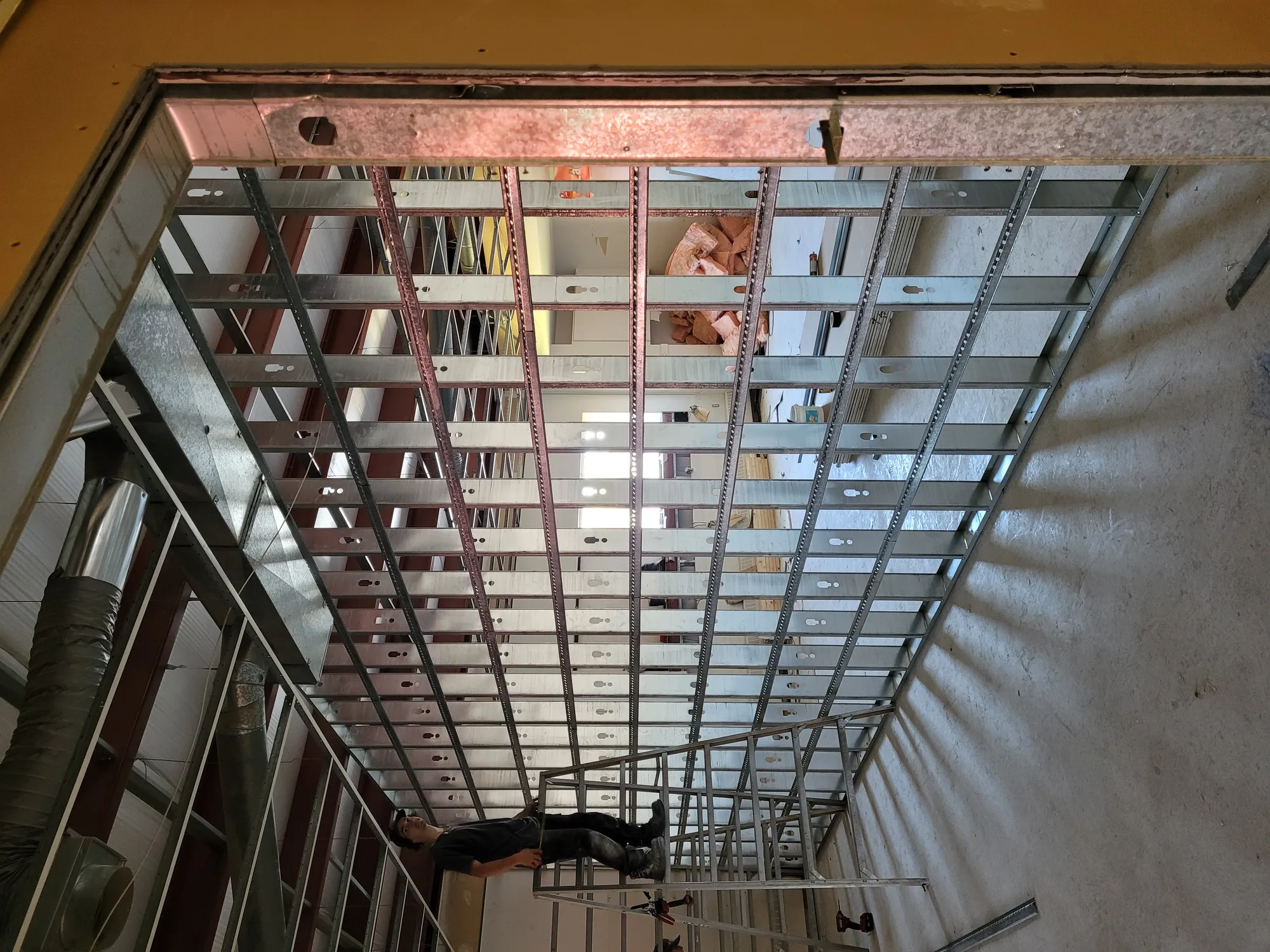 Steel stud framing underway on an RBSL job site