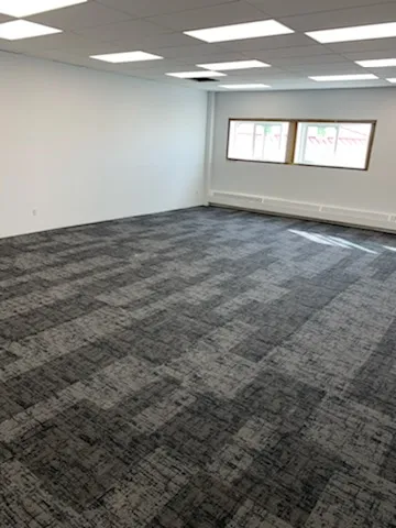 Newly installed commercial corridor flooring in a high traffic building